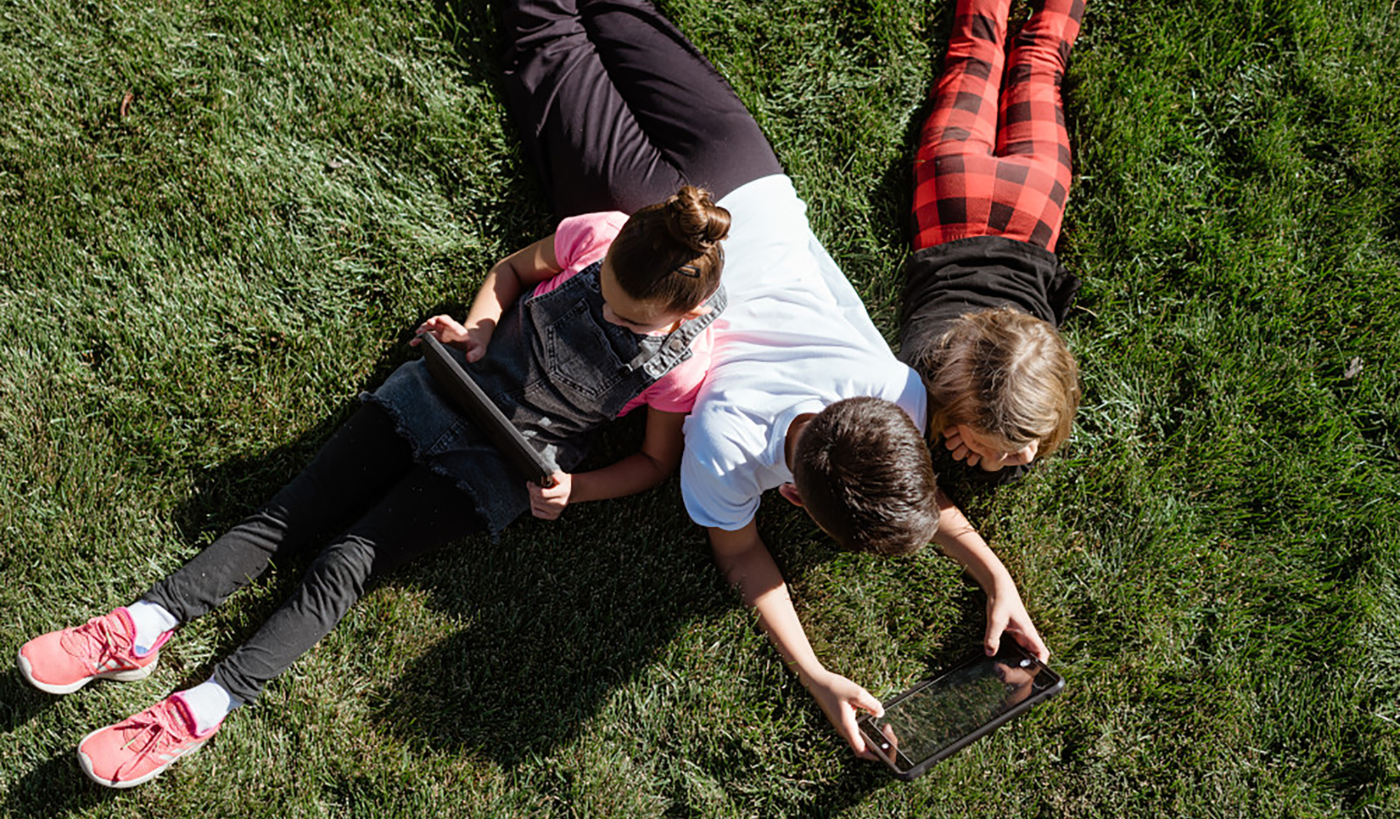 People lying on grass